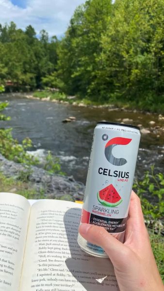 A can of Celsius energy drink sits on a desk, a popular choice for a quick caffeine boost among students.