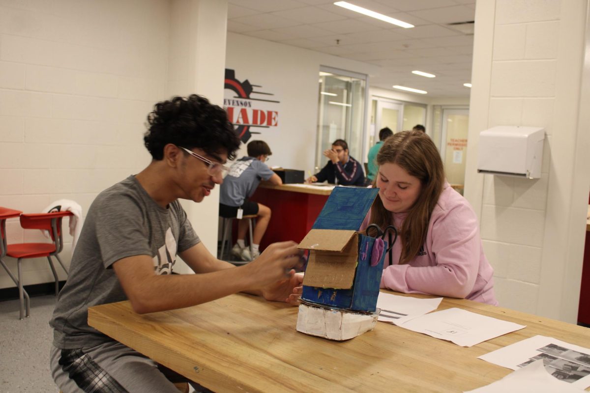 With laser focus Har Murad '28 and Savanna Voyles '28 both work together on their MADE design. They are working to add final touches to their project. "It was exciting to get some real world experience as a freshmen," Voyles said.