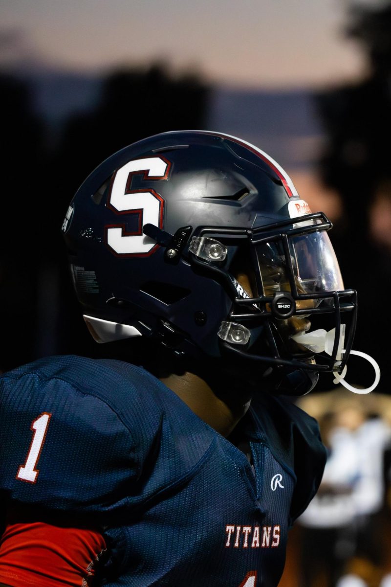 Wide receiver Ronnie Hill '26 looks onto the field during the home game against Dakota High School on Sept. 20. 