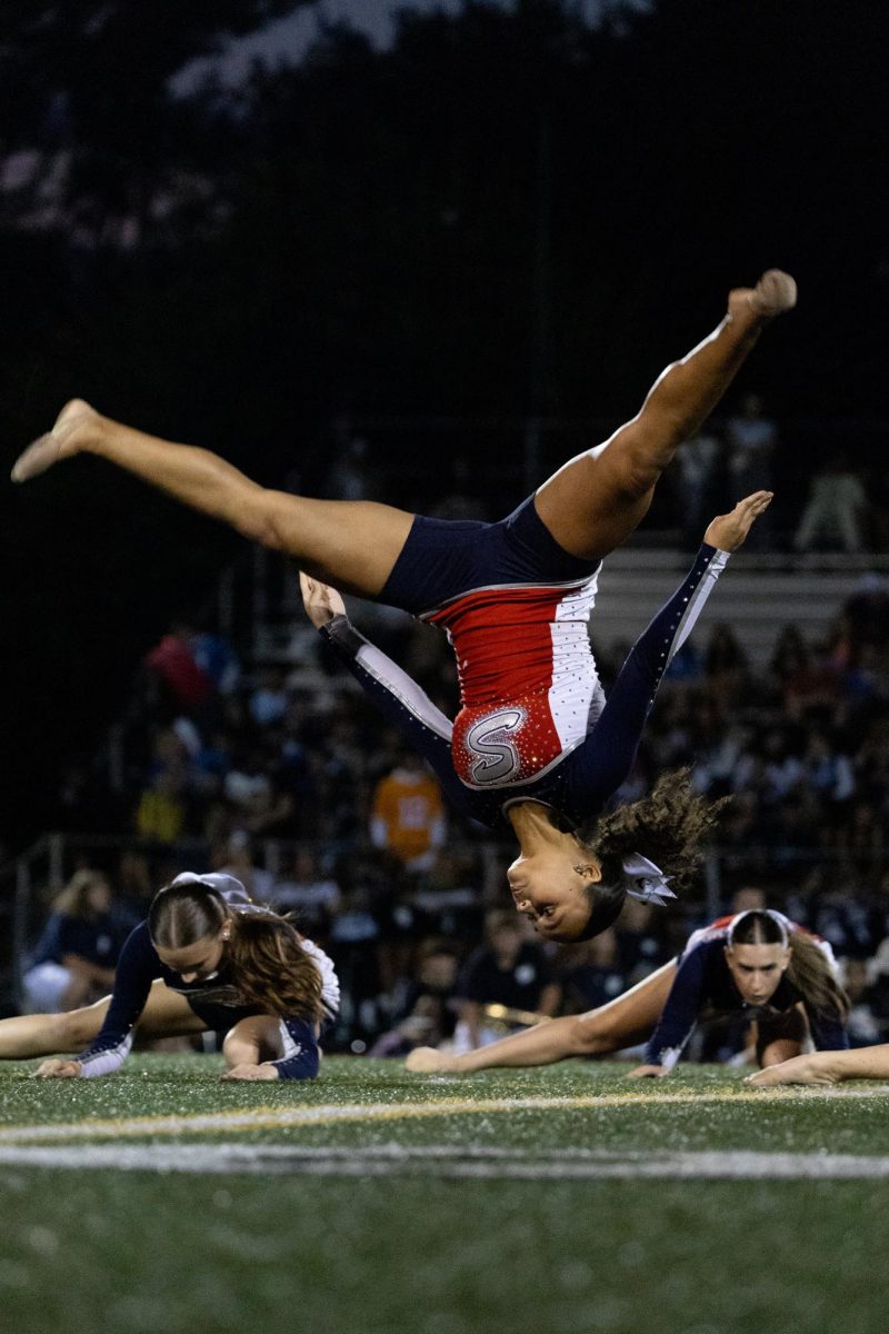 The dance team performs at the halftime show. Ava Wingfield '25 said her favorite part of the game is halftime because she "likes to show off our performances." 