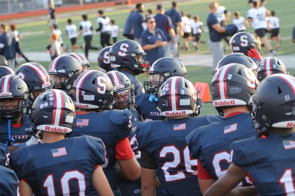 David Johnson '25 (#10) stands with his teammates before taking the field, soaking in one of his final moments as a Titan.
