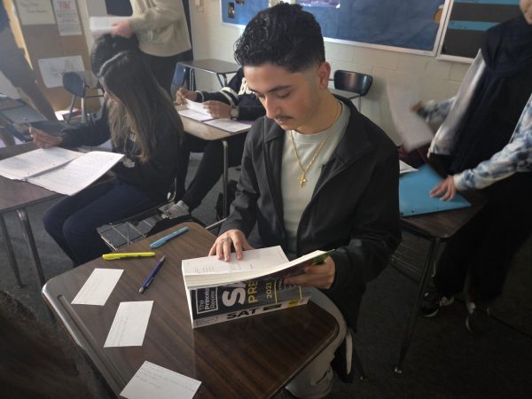 Student working in SAT workbook