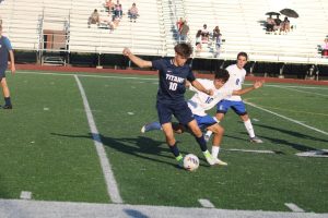 Alek Sadikovic '26 advances the ball down the field in the Dakota vs. Stevenson game. 