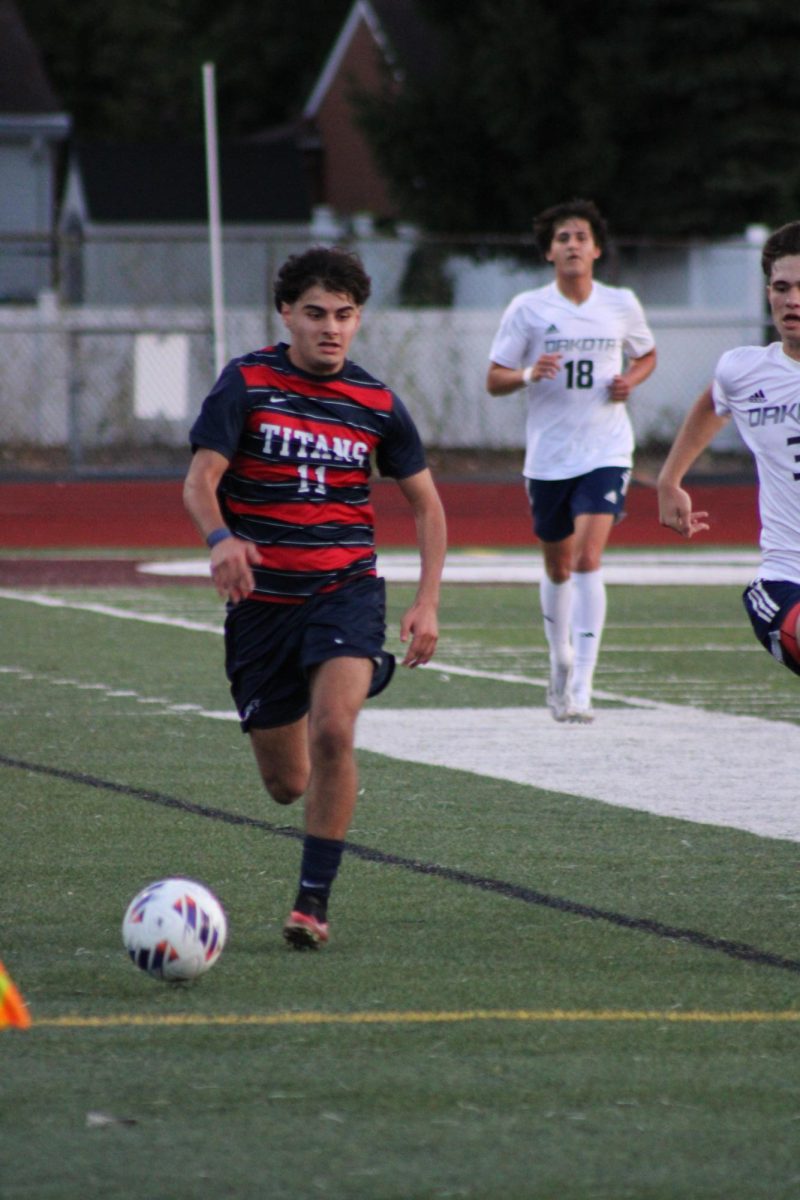 Racing down the field, Austin
Abdulmasieh '27 tries to intercept a pass against Dakota, ultimately losing 2–0. Despite the loss, Austin said he stayed confident in the team’s season and proud of their effort. “They like to play out the back and keep possession, so I ran a lot and got tired,” Abdulmasieh said.

