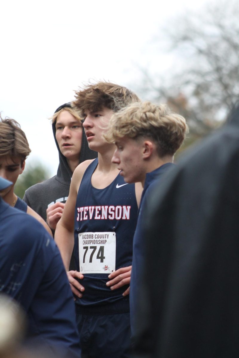 The team huddles before one of their last cross-country meets on Oct. 15. 